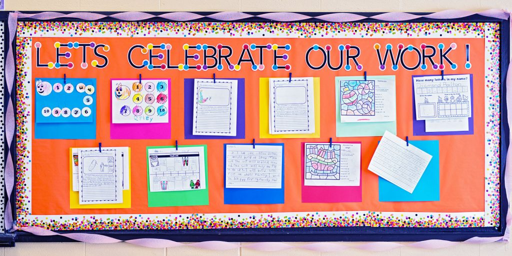 Bright bulletin board that says "Let's Celebrate Our Work"